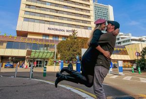 Couple kissing in front of the Panorama Hotel